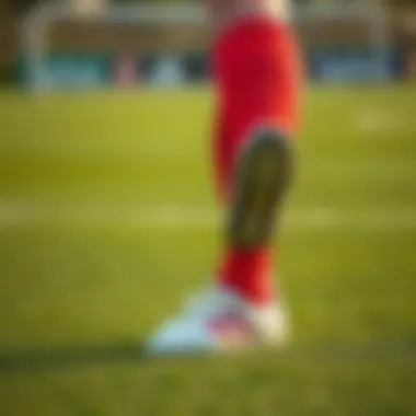 Dynamic action shot of a player wearing Adidas turf shoes on the field