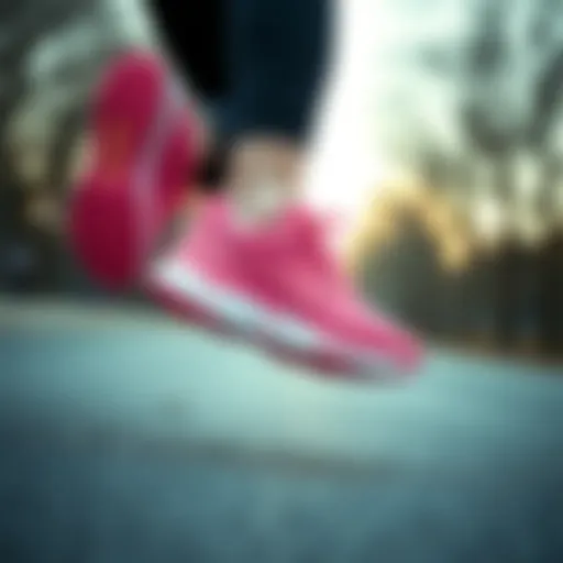 Stylish pink New Balance sneakers on a run